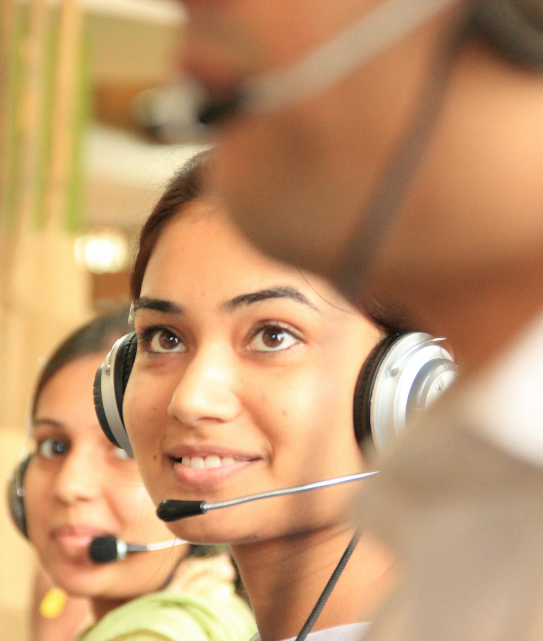 Qualification specialist on a live call, wearing a headset